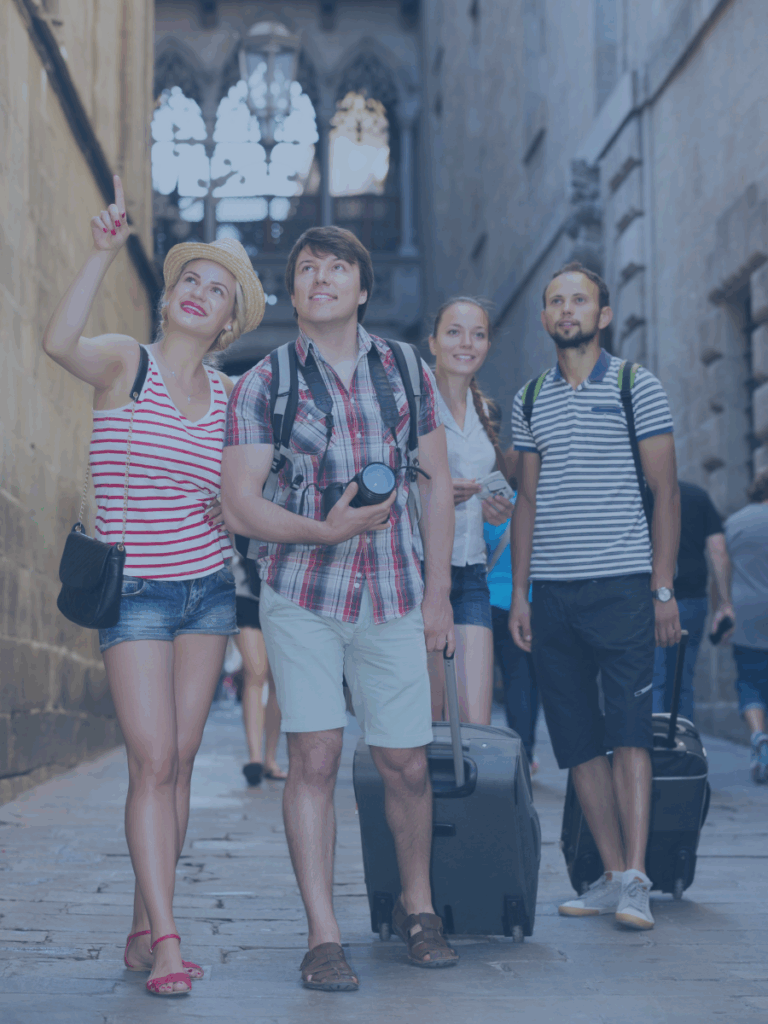 Group of people who appear to be tourists travling.