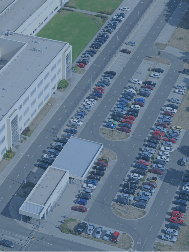 Overhead view of an automobile sales lot.